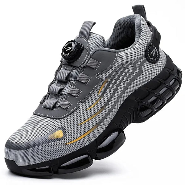 Grijze sportschoen met zwarte zool en gouden accenten, ademend mesh, geschikt voor hardlopen en fitness. Innovatief vetersysteem, comfortabele pasvorm.
