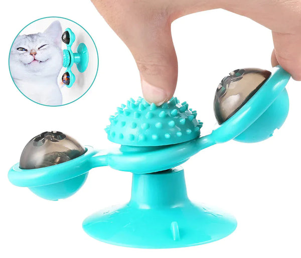 Turquoise kattenspeeltje met zuignap, draaiende bollen en borstel, ideaal voor kattenvermaak en tandverzorging. Geschikt voor interactieve speeltijd.