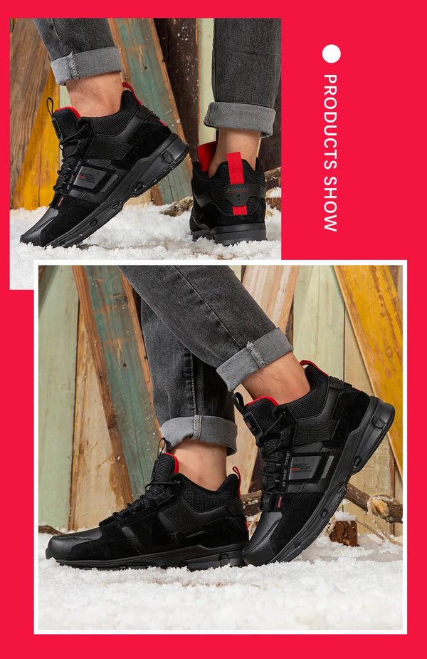 Zwarte sneakers met rode accenten, gedragen door een model op sneeuw, tegen een rustieke houten achtergrond. Stijlvolle herenschoenen, wintermode.