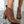 Bruine enkellaarsjes met slangenprint en blokhak, stijlvolle damesmode, glanzend oppervlak, trendy schoenen voor herfst en winter.