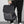 Man met zwarte rugzak, minimalistisch design, waterdicht materiaal, geschikt voor dagelijks gebruik, ideaal voor school of werk, trendy accessoire.