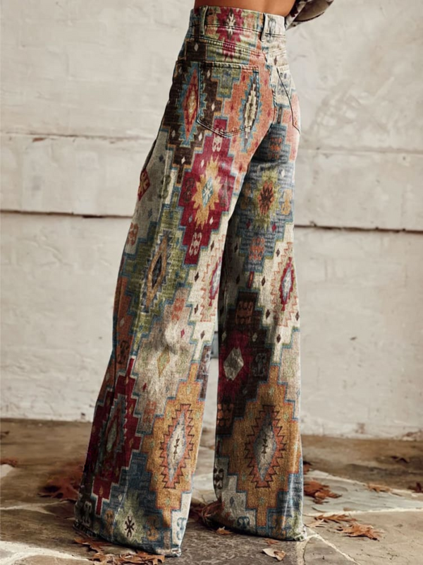 Vintage boho wijde broek met kleurrijk etnisch patroon, perfect voor damesmode. Ideaal voor casual en festival outfits. Comfortabele pasvorm.