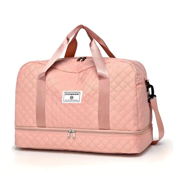 Roze gewatteerde reistas met handvatten en schouderriem, ideaal voor dames. Stijlvolle weekendtas met ritssluiting en ruim interieur.