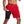 Man in rode sportshorts met zwarte compressiezak, luistert naar muziek. Ideaal voor fitness, hardlopen, sportkleding. Comfortabel en functioneel ontwerp.