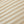 Geribbelde beige fleece stof close-up, zachte textuur, ideaal voor warme dekens en kleding. Perfect voor wintermode en interieurdecoratie.