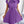 Vrouw in paarse geplooide jurk met strik, korte mouwen, elegante mode, trendy dameskleding, stijlvolle outfit voor speciale gelegenheden.