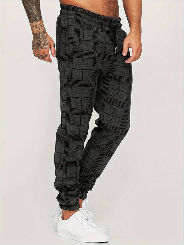 Grijze geruite joggingbroek voor heren, casual streetwear, comfortabele pasvorm, elastische tailleband, trendy mode, perfect voor dagelijks gebruik.