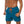 Man in blauwe zwembroek met oranje koord, gespierde torso, strandkleding, zomermode, sportieve zwemshorts, herenbadmode.