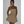 Vrouw in strapless gouden glitterjurk, elegante avondkleding, modetrend 2023, feestelijke outfit, glamour stijl, kort cocktailjurkje.