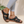 Zwarte leren sandalen voor dames met open teen en verstelbare band, gedragen met grijze legging. Comfortabele zomerschoenen, modieuze stijl.
