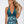 Vrouw in stijlvolle groene halter-badpak met tropisch bladpatroon, strandmode, zomerse look, trendy zwemkleding, modefotografie.