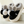 Zwarte en grijze pluche pantoffels met konijnenoren en pompons, warme winterhuisschoenen voor dames, comfortabele antislip zool.