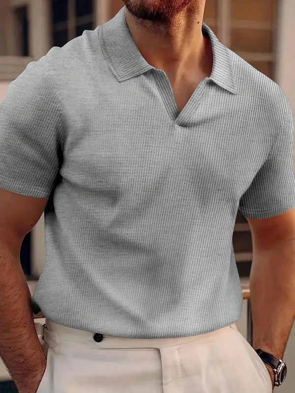Grijze geribbelde polo voor heren, korte mouwen, casual stijl, perfect voor zomeroutfits. Comfortabele pasvorm, modieuze herenkleding.