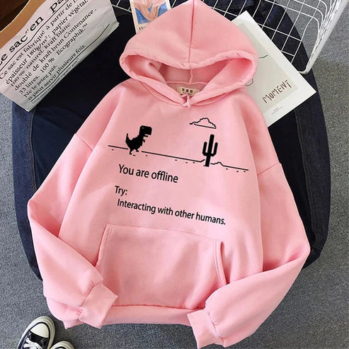 Roze hoodie met dinosaurus en cactus print, tekst "You are offline", comfortabele casual kleding, unisex mode, trendy streetwear.