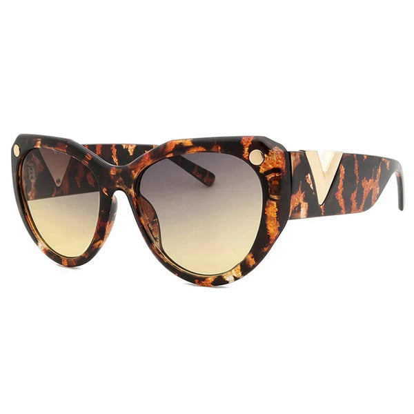 Zwarte oversized zonnebril voor dames met schildpadpatroon, luxe merk, modieus ontwerp, grote glazen, UV-bescherming, trendy accessoire.