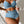 Vrouw in blauwe hoge taille bikini met ruches, gewatteerde push-up top. Trendy badmode 2024, sexy en stijlvol badpak voor dames.
