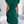 Groene geplooide jurk met korte mouwen, gedragen door een vrouw, gefotografeerd van achteren. Perfect voor zomermode en elegante casual looks.