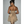 Vrouw in gouden strapless jurk met strik, glitterdetails. Perfect voor feestelijke gelegenheden. Elegante avondmode, trendy dameskleding.