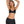 Zwarte dames sportbeha en shorts set, comfortabele fitnesskleding, ideaal voor yoga en workouts. Stijlvolle en functionele sportkleding.