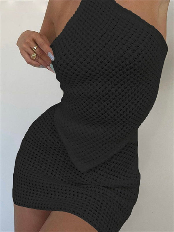 Zwarte gebreide strapless jurk, nauwsluitend ontwerp, textuurpatroon, elegante avondkleding, modieuze dameskleding, trendy zomerjurk.