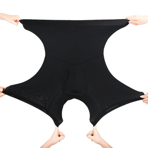 Zwarte elastische shapewear short, uitgerekt door vier handen. Naadloos ontwerp, hoge taille, buikcontrole, comfortabele pasvorm.
