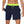 Man in donkerblauwe zwembroek met felgroene tailleband, toont binnenvoering. Ideaal voor strand, zwemmen, sport. Comfortabele heren zwemkleding.
