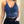Blauwe kanten crop top met bloemenpatroon, gedragen door vrouw. Modieuze dameskleding, trendy zomeroutfit, stijlvolle bralette.