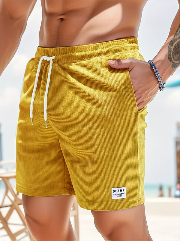 Gele corduroy zwembroek voor heren met witte trekkoord, casual strandmode. Perfect voor zomerse dagen aan zee. Comfortabel en stijlvol design.