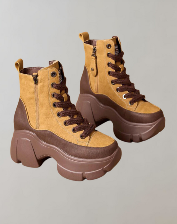 Bruine en gele platformlaarzen met dikke zolen en veters, trendy damesmode, stevige schoenen, casual stijl, herfst- en wintercollectie.