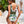 Vrouw in tropisch badpak met bladeren en dierenprint, buiten bij zwembad. Zomermode, strandkleding, stijlvolle badmode, vakantie vibes.