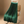 Groene geplooide rok op houten stoel, elegante damesmode, stijlvolle kleding, trendy plissérok, modieuze outfit, interieurinspiratie.