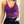 Paarse kanten crop top met bloemenpatroon, gedragen door vrouw. Modieuze dameskleding, trendy zomeroutfit, stijlvolle bralette.
