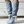 Lichtblauwe dameslaarzen met hoge hak, witte gespsluiting en knopen, modieuze kniehoge schoenen, trendy herfst- en wintermode.