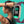 Vrouw met fitness tracker, close-up van smartwatch met paarse band, toont tijd en datum. Gezondheidstechnologie, sportaccessoire, modern design.