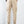 Beige cargobroek voor heren, achteraanzicht, met elastische enkels en zakken, casual streetwear, gecombineerd met witte sneakers.