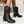 Zwarte dameslaarzen met blokhak op witte kiezelstenen, stijlvolle enkellaarzen voor herfstmode, perfect voor casual en chique outfits.