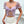 Vrouw in lila bloemenkorset met pofmouwen en kanten details, gecombineerd met witte rok. Trendy mode, elegante dameskleding, zomeroutfit.