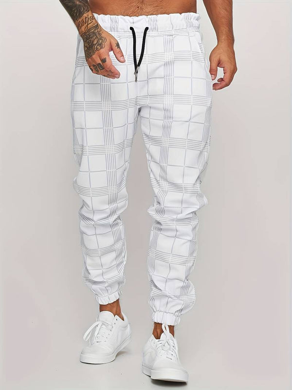 Witte geruite joggingbroek voor heren, casual streetwear, elastische tailleband, comfortabele pasvorm, ideaal voor sport en vrije tijd.