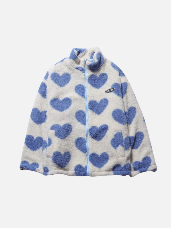 Witte fleece jas met blauwe hartjes, ritssluiting en opstaande kraag. Trendy damesmode, warme winterkleding, casual stijl.