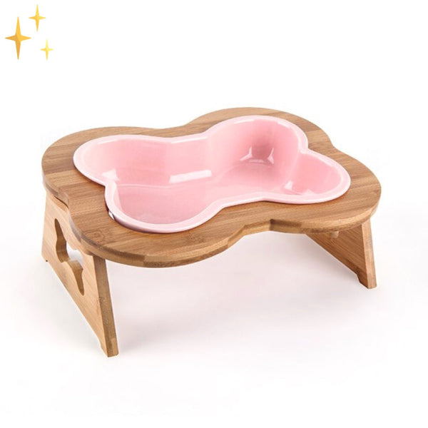 Houten hondenvoerbak met roze botvormige kom, verhoogd ontwerp voor comfortabel eten. Ideaal voor kleine tot middelgrote honden.