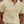Man in crèmekleurige geribbelde polo, korte mouwen, stijlvolle casual outfit, zomermode, herenkleding, buitenomgeving.
