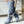 Grijze dameslaarzen met hoge hak, knopen en witte riem, stijlvolle modeaccessoire voor herfst en winter, perfect voor casual en chique outfits.