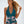 Vrouw in groene halternek badpak met roze bloemenprint, strandkleding, zomermode, elegante zwemkleding, trendy damesbadpak.
