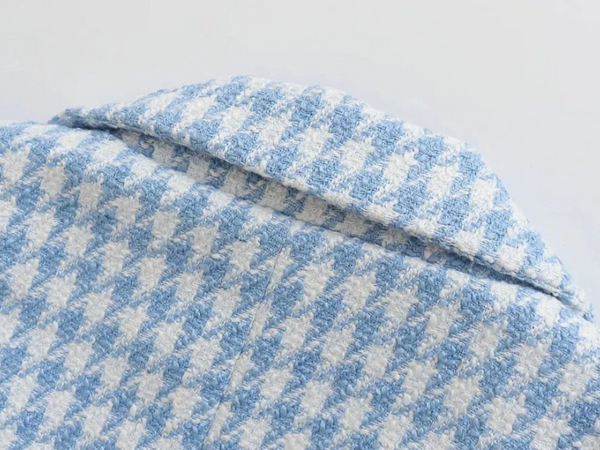 Blauw-wit pied-de-poule stofdetail, close-up van textuur en patroon. Modetrend, hoogwaardige textiel, stijlvol ontwerp.