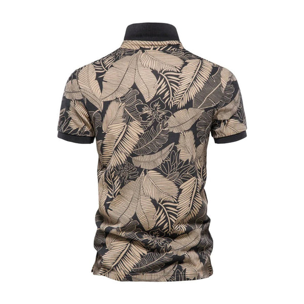 Zwarte polo met beige tropische bladerenprint, korte mouwen en kraag. Stijlvolle herenkleding, perfect voor casual en zomerse outfits.