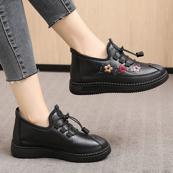 Zwarte leren damessneakers met bloemenborduursel, casual stijl, comfortabele pasvorm, ideaal voor dagelijks gebruik en modieuze outfits.