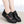 Zwarte damessneakers met bloemenborduursel, comfortabele zool en vetersluiting. Perfect voor casual en modieuze outfits.