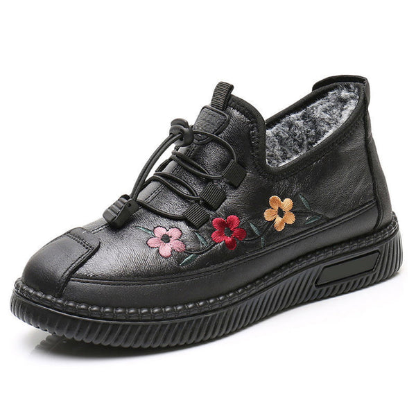 Zwarte leren damesschoen met kleurrijke bloemenborduursels, comfortabele dikke zool en vetersluiting. Perfect voor casual en modieuze outfits.