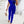 Blauwe jumpsuit met asymmetrisch ontwerp en pailletten top, gedragen door vrouw met beige handtas en hakken, elegante mode voor dames.