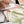 Damesondergoed in pastelkleuren met kanten details, liggend op een bed. Comfortabele slipjes, modieuze lingerie, zachte stoffen.